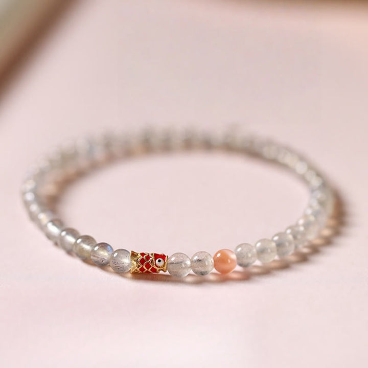 Bracelet de guérison ultra-fin en pierre de lune et poisson koï Buddha Stones