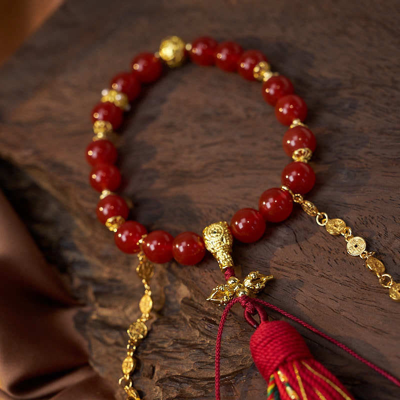 Mala de poignet calme en agate rouge et Buddha Stones , 18 perles en cuivre et pompon tibétain