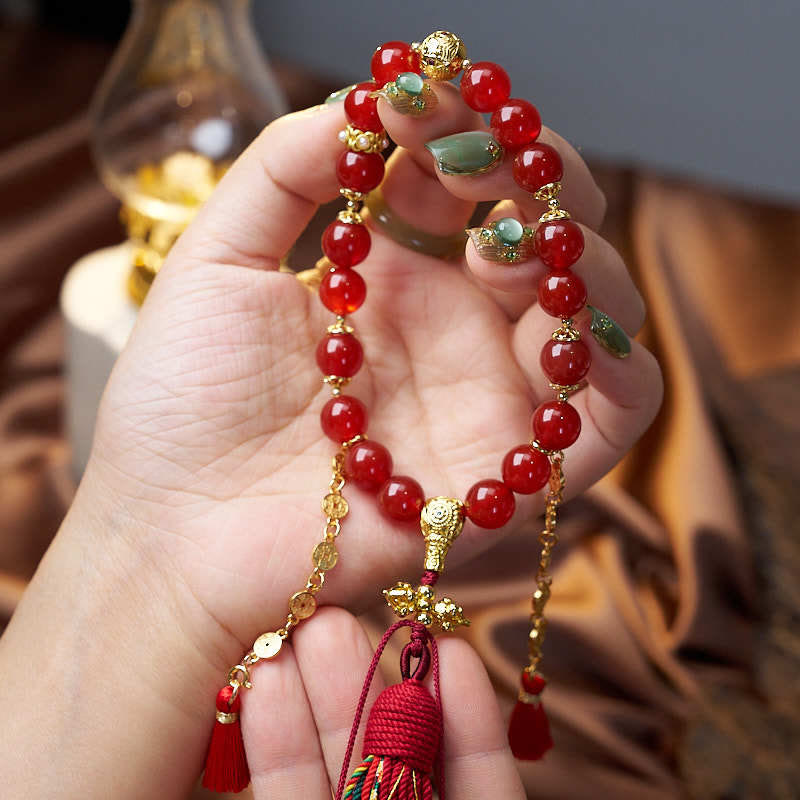Mala de poignet calme en agate rouge et Buddha Stones , 18 perles en cuivre et pompon tibétain