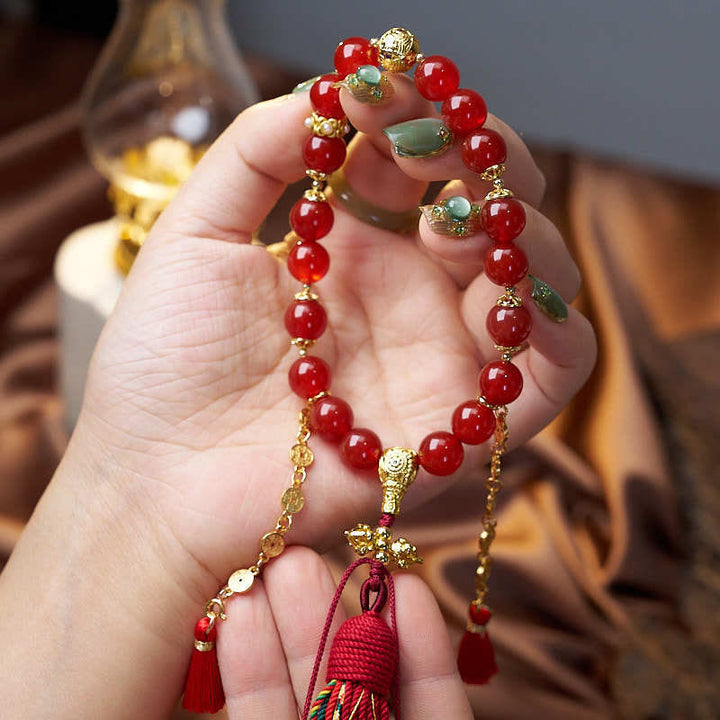 Mala de poignet calme en agate rouge et Buddha Stones , 18 perles en cuivre et pompon tibétain