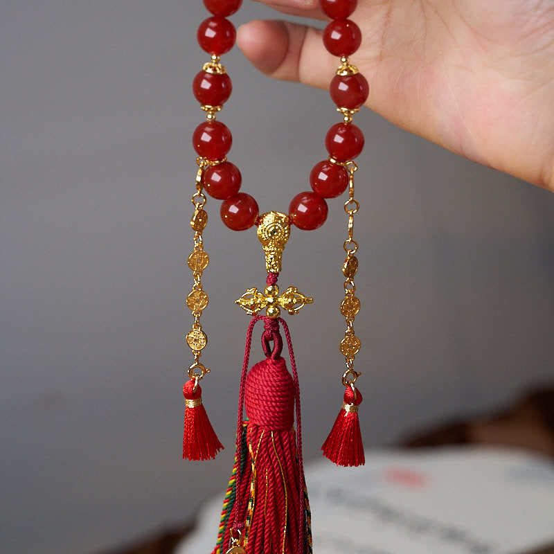 Mala de poignet calme en agate rouge et Buddha Stones , 18 perles en cuivre et pompon tibétain