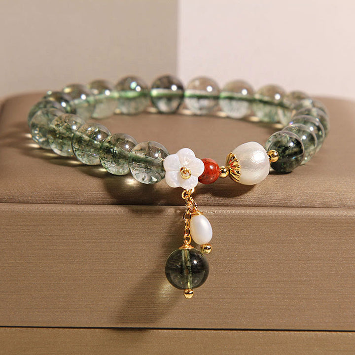 Bracelet Buddha Stones en perles fantômes vertes naturelles, coquillages et fleurs positives
