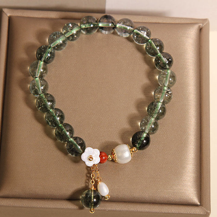 Bracelet Buddha Stones en perles fantômes vertes naturelles, coquillages et fleurs positives