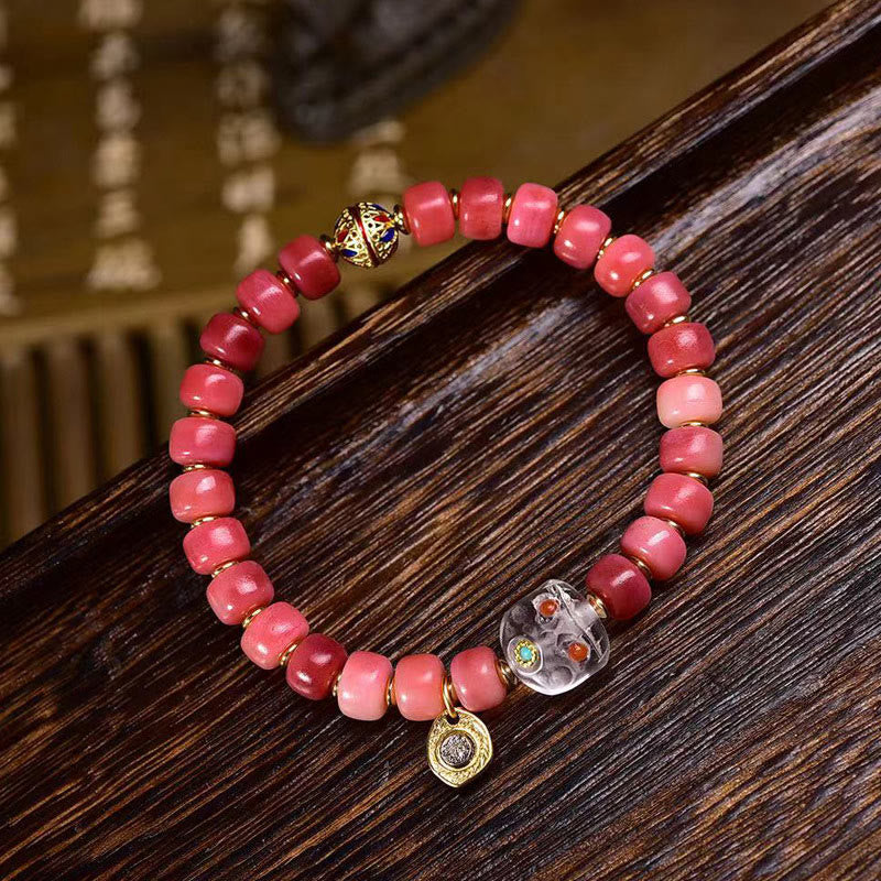 Bracelet porte-bonheur tibétain en Buddha Stones de chameau, cuivre et agate rouge
