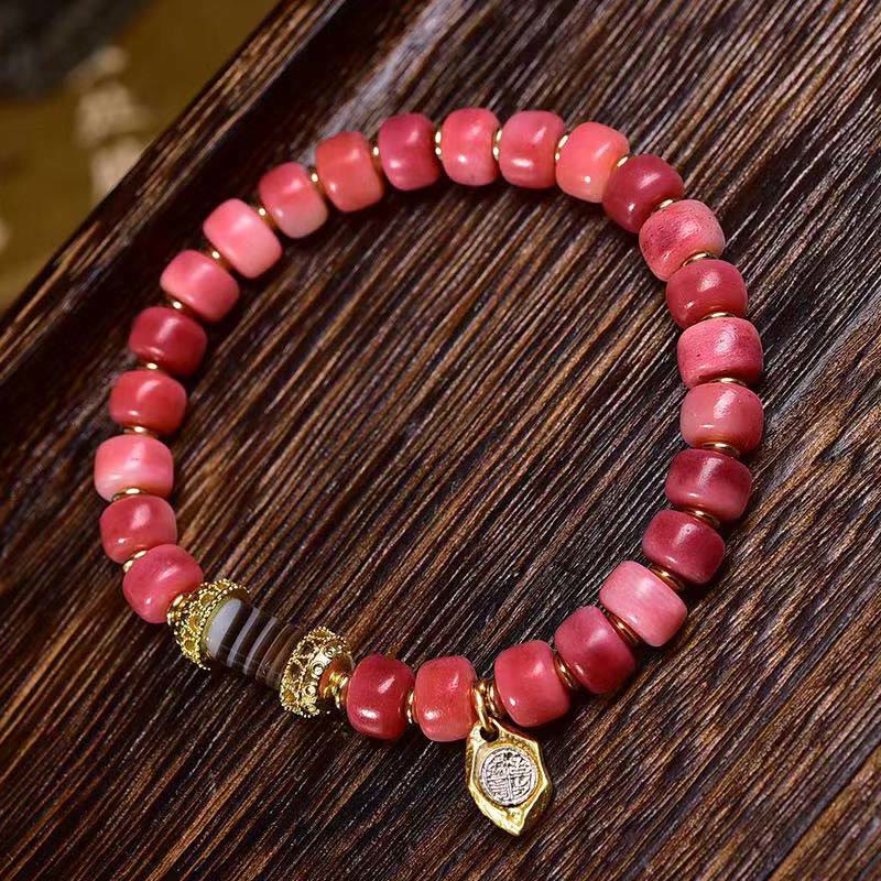 Bracelet porte-bonheur tibétain en Buddha Stones de chameau, cuivre et agate rouge