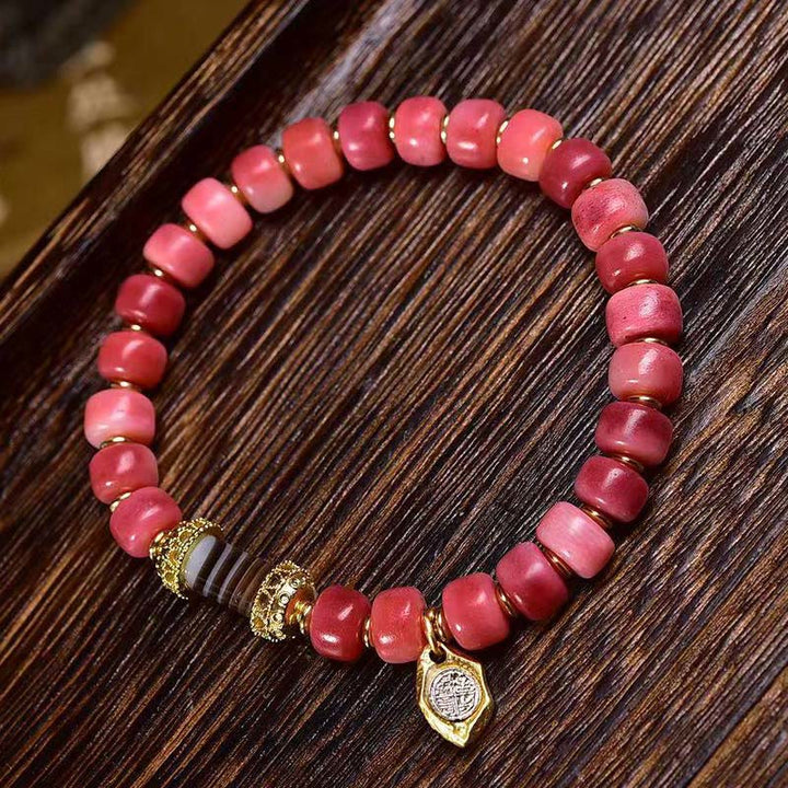 Bracelet porte-bonheur tibétain en Buddha Stones de chameau, cuivre et agate rouge