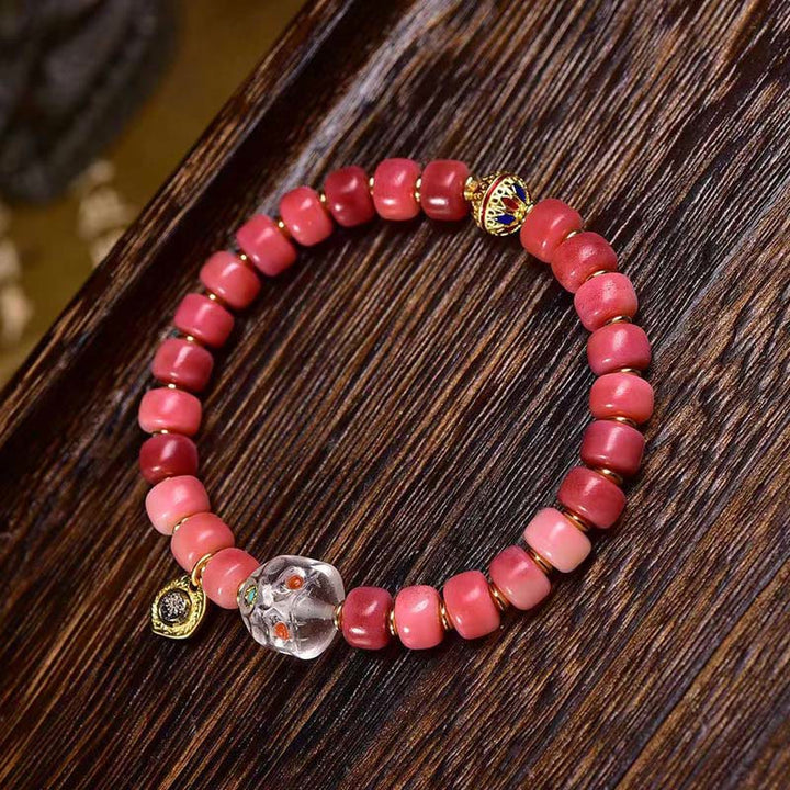 Bracelet porte-bonheur tibétain en Buddha Stones de chameau, cuivre et agate rouge