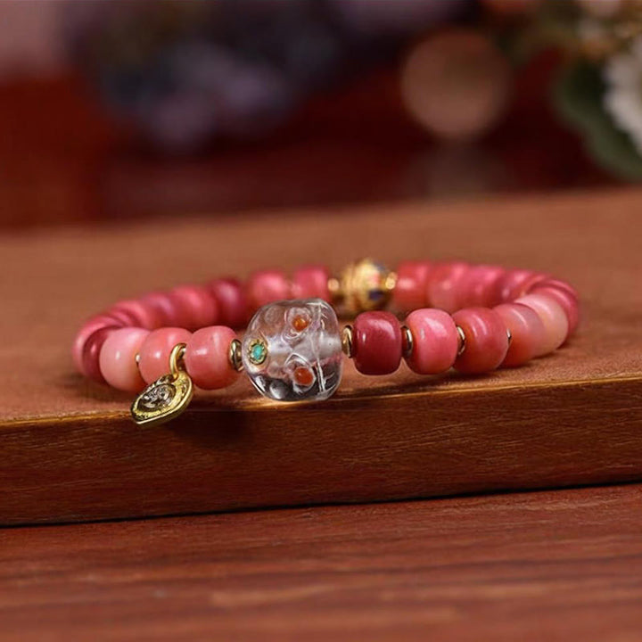 Bracelet porte-bonheur tibétain en Buddha Stones de chameau, cuivre et agate rouge