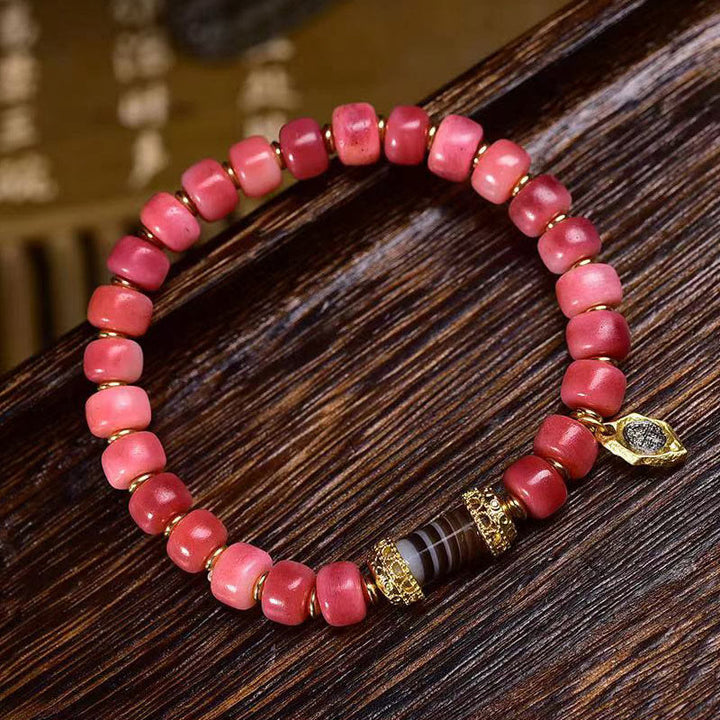 Bracelet porte-bonheur tibétain en Buddha Stones de chameau, cuivre et agate rouge