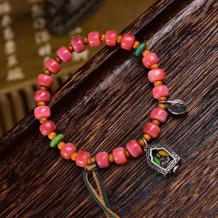 Bracelet porte-bonheur tibétain en Buddha Stones de chameau, cuivre et agate rouge