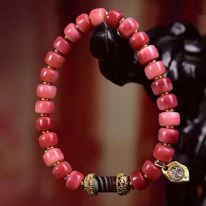 Bracelet porte-bonheur tibétain en Buddha Stones de chameau, cuivre et agate rouge