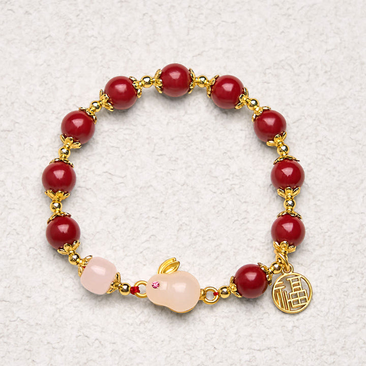 Bracelet de bénédiction avec breloque en forme de lapin mignon et de personnage de cinabre en Buddha Stones