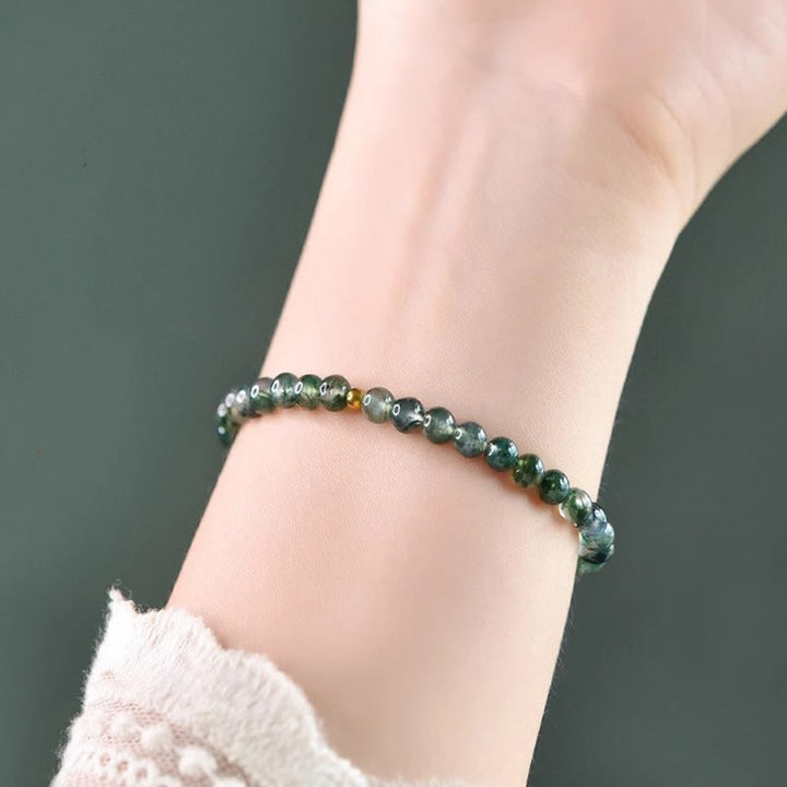 Bracelet apaisant en perles porte-bonheur en agate mousse et Buddha Stones