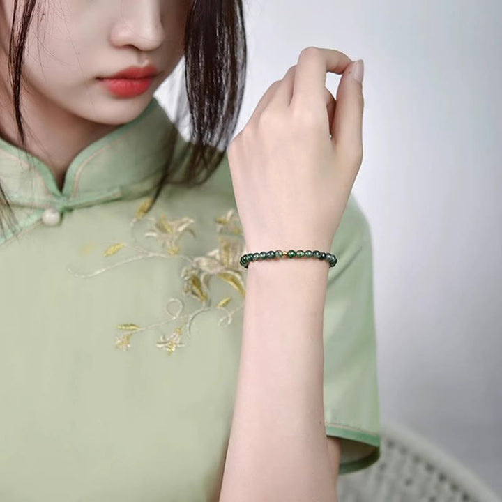 Bracelet apaisant en perles porte-bonheur en agate mousse et Buddha Stones