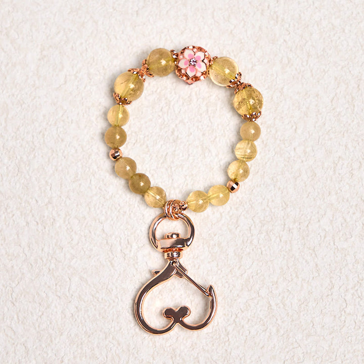 Porte-clés à suspendre en quartz rutile doré et Buddha Stones