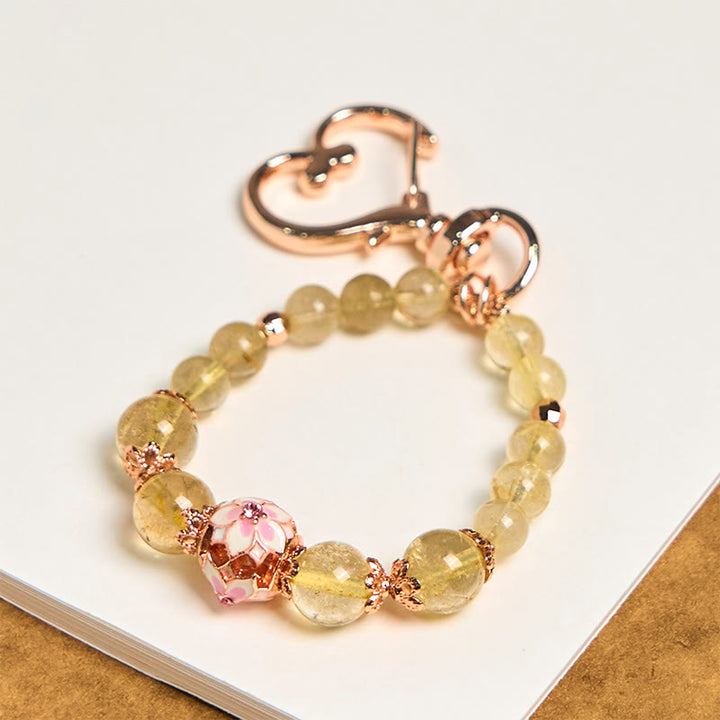 Porte-clés à suspendre en quartz rutile doré et Buddha Stones