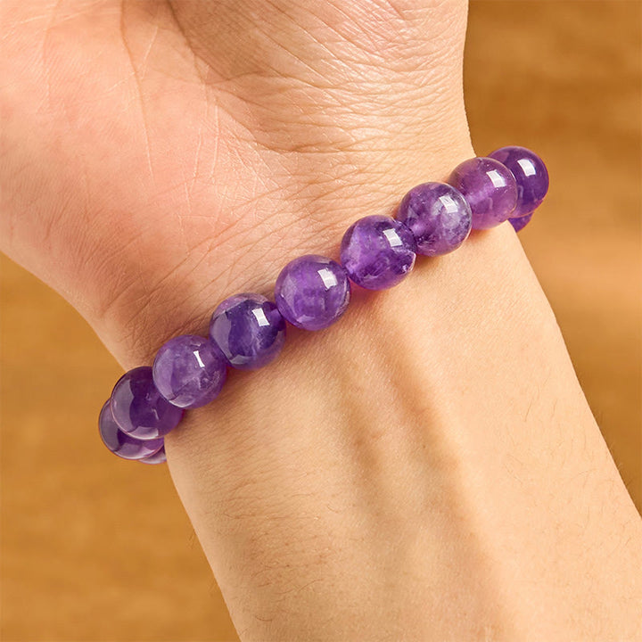 Bracelet spirituel avec breloque en améthyste naturelle et Buddha Stones