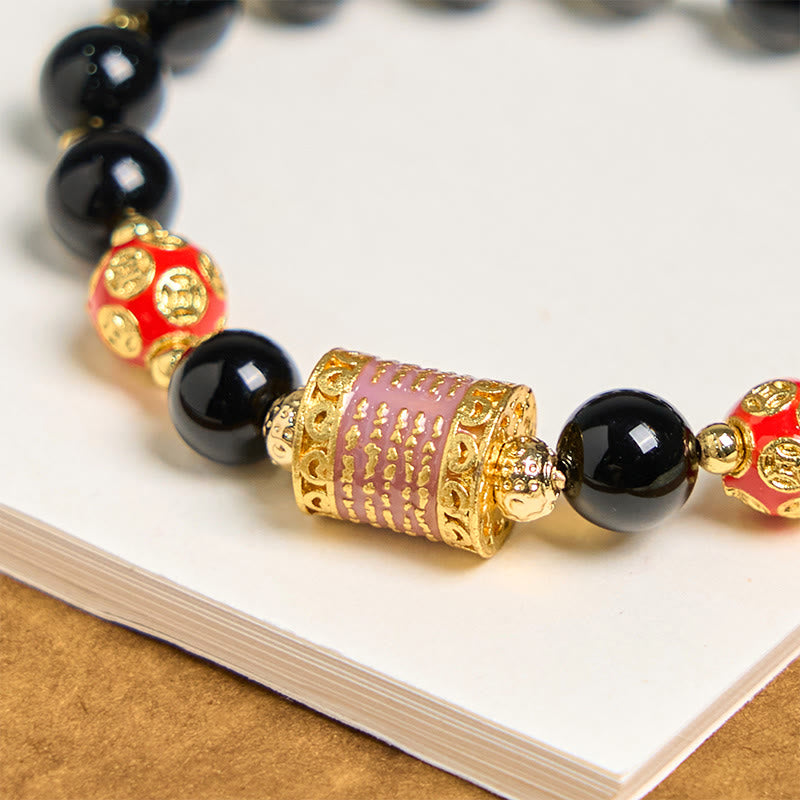 Bracelet porte-bonheur en Buddha Stones noir naturel et cinq pièces de cuivre sacrées