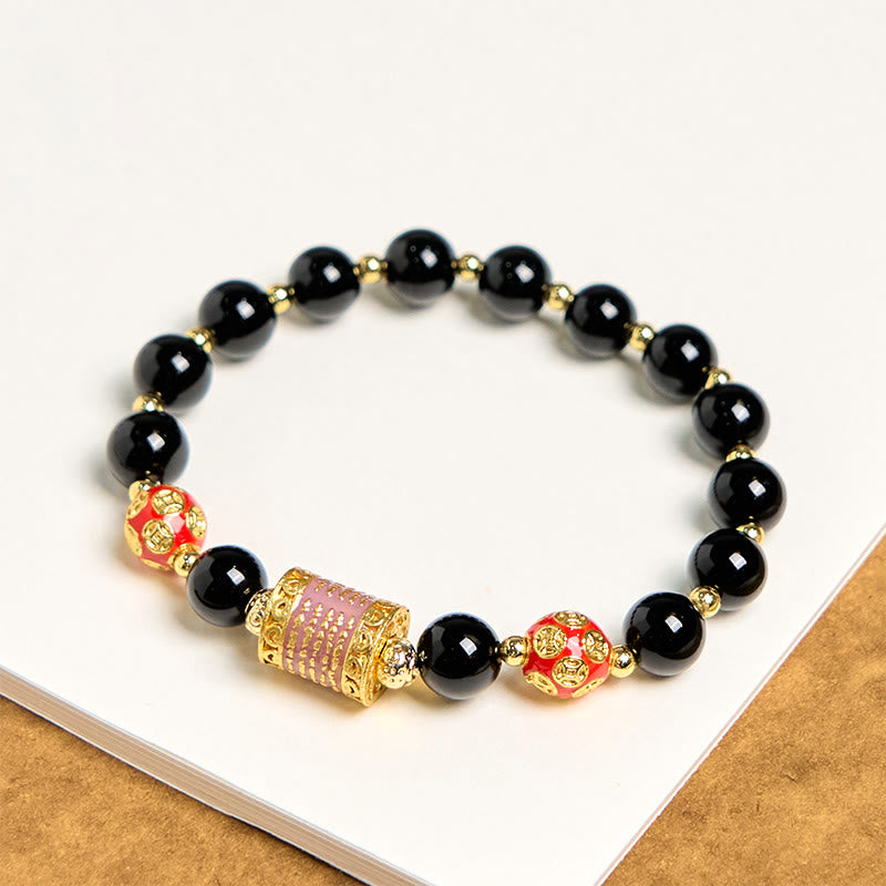 Bracelet porte-bonheur en Buddha Stones noir naturel et cinq pièces de cuivre sacrées
