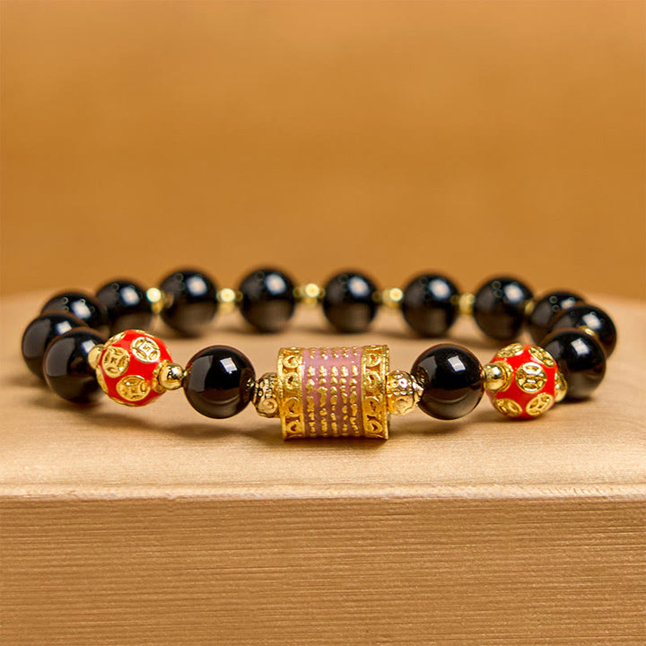 Bracelet porte-bonheur en Buddha Stones noir naturel et cinq pièces de cuivre sacrées