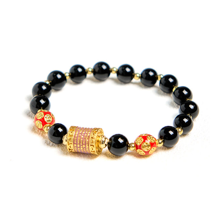 Bracelet porte-bonheur en Buddha Stones noir naturel et cinq pièces de cuivre sacrées