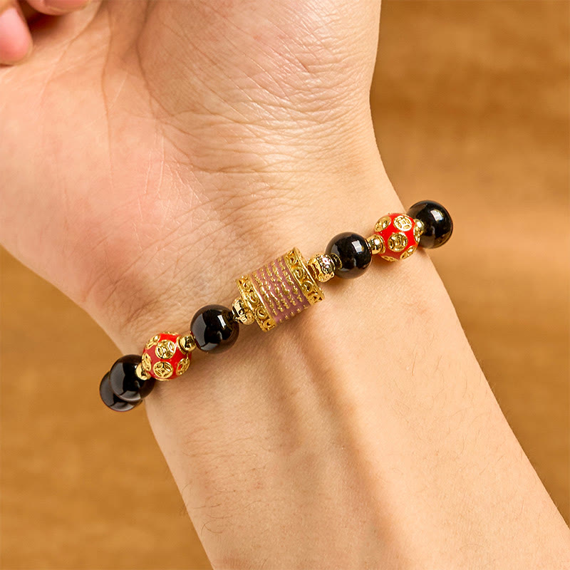 Bracelet porte-bonheur en Buddha Stones noir naturel et cinq pièces de cuivre sacrées