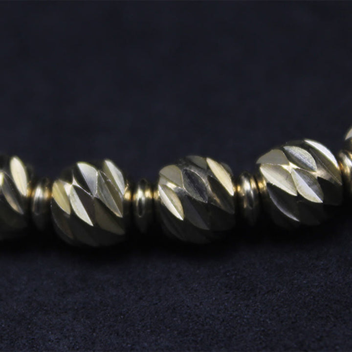 Bracelet de richesse en perles de cuivre et laiton, motif de couteau sculpté vintage en Buddha Stones