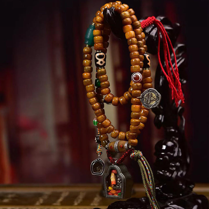 Mala tibétain à 108 perles en os de chameau et pompon porte-bonheur en Buddha Stones