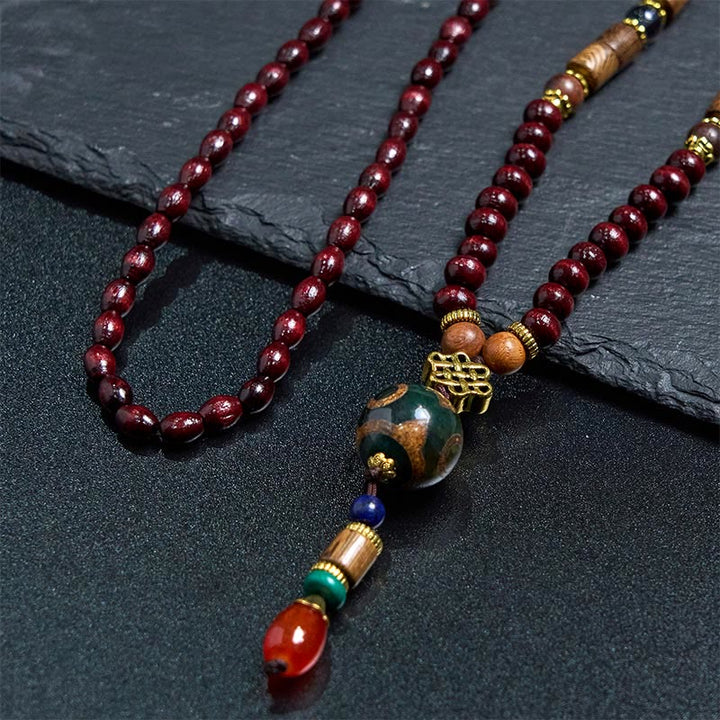 Collier pendentif tête d'éléphant en perles dzi de protection en bois de wengé Buddha Stones fait main