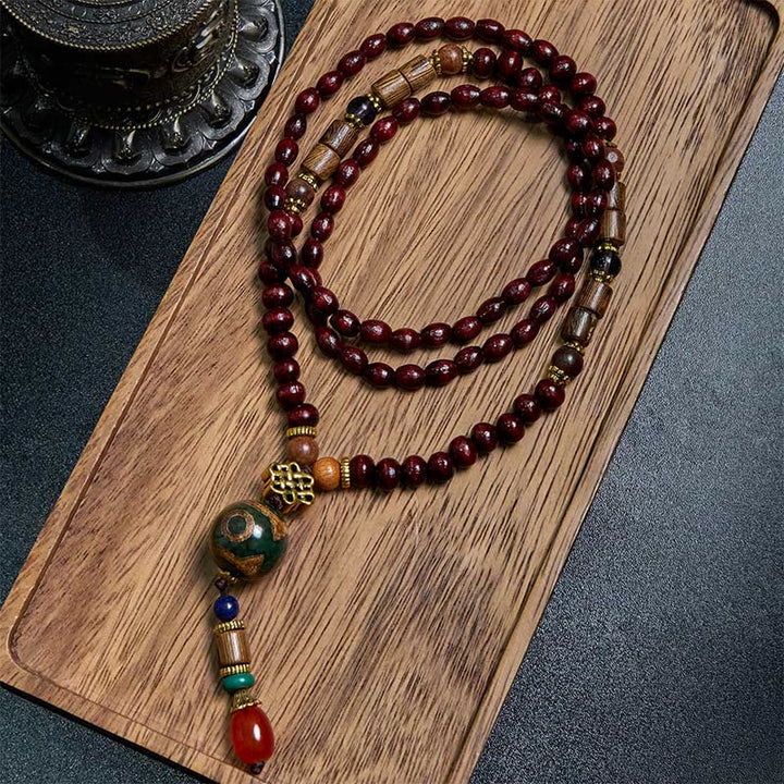Collier pendentif tête d'éléphant en perles dzi de protection en bois de wengé Buddha Stones fait main