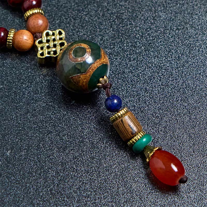 Collier pendentif tête d'éléphant en perles dzi de protection en bois de wengé Buddha Stones fait main