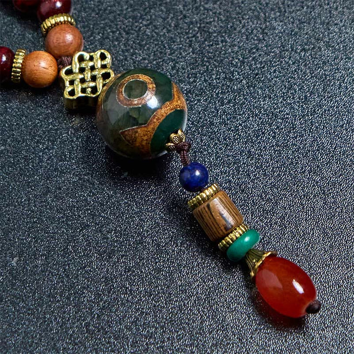 Collier pendentif tête d'éléphant en perles dzi de protection en bois de wengé Buddha Stones fait main