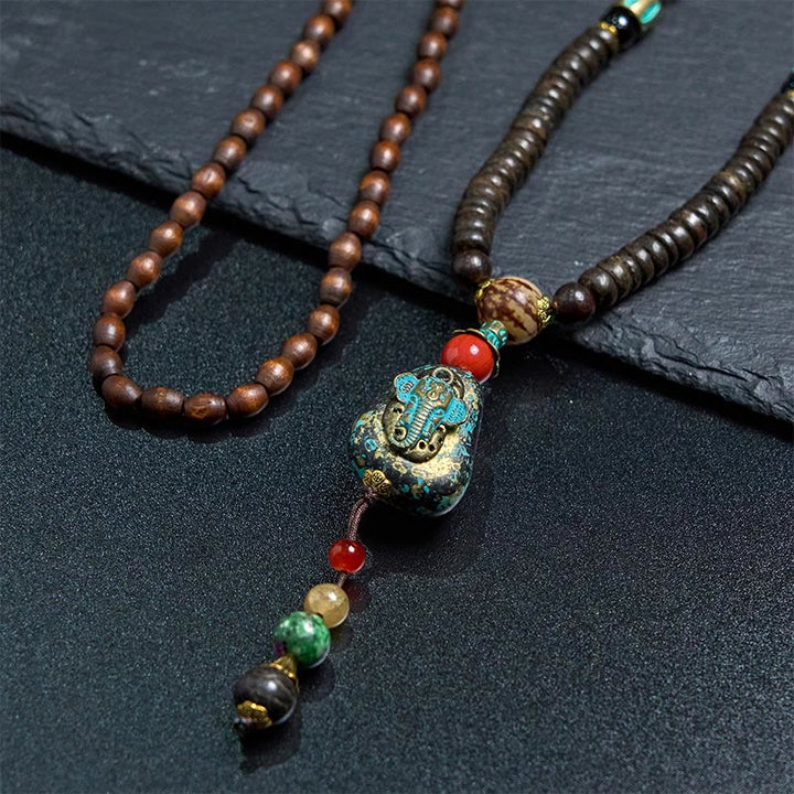 Collier pendentif tête d'éléphant en perles dzi de protection en bois de wengé Buddha Stones fait main