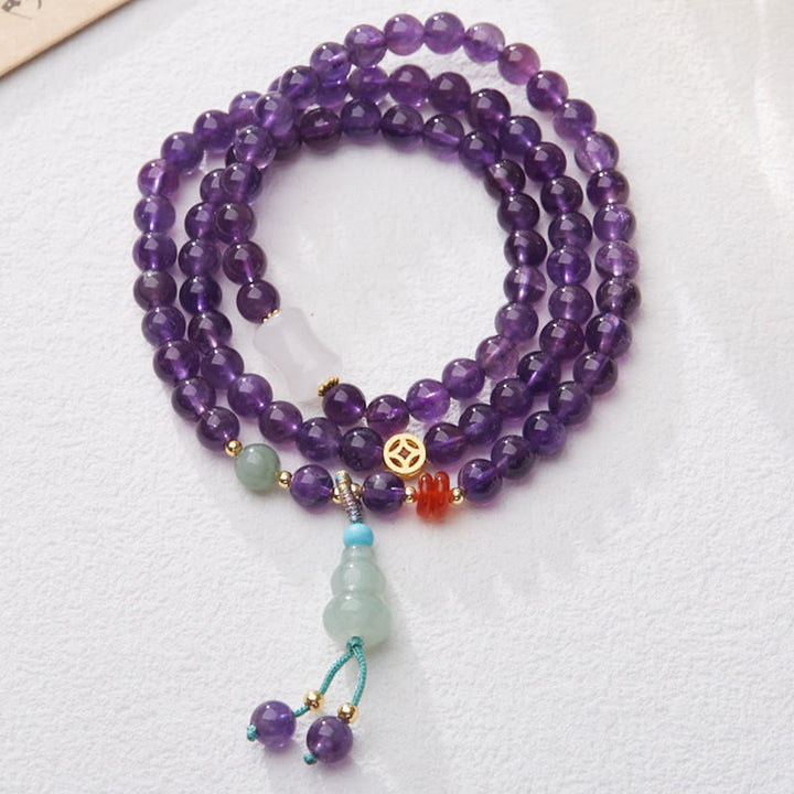 Bracelet multicouche en Buddha Stones, perles d'améthyste naturelle, pièce de monnaie suspendue, calcédoine, lotus, équilibre
