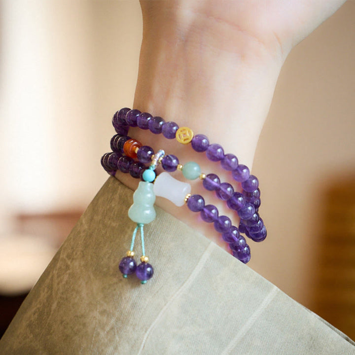 Bracelet multicouche en Buddha Stones, perles d'améthyste naturelle, pièce de monnaie suspendue, calcédoine, lotus, équilibre