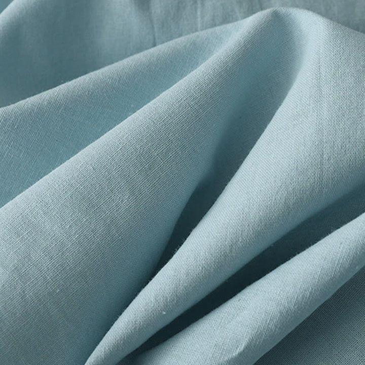 Robe mi-longue décontractée en coton et lin avec boutons au dos, couleur pure, col ras du cou, manches courtes et poches