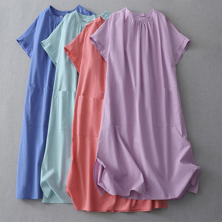 Robe mi-longue décontractée en coton et lin avec boutons au dos, couleur pure, col ras du cou, manches courtes et poches