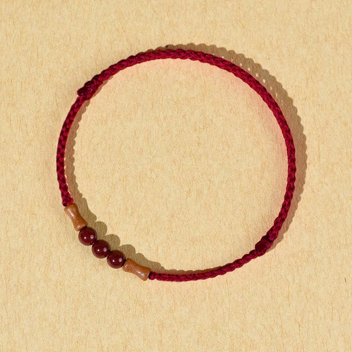 Bracelet de bénédiction en perles de cinabre et bois de pêcher, Buddha Stones