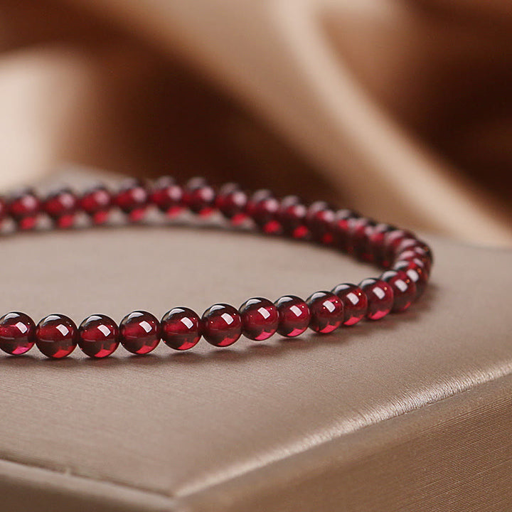 Bracelet Buddha Stones Perles de grenat naturel 4 mm Fleur Passion