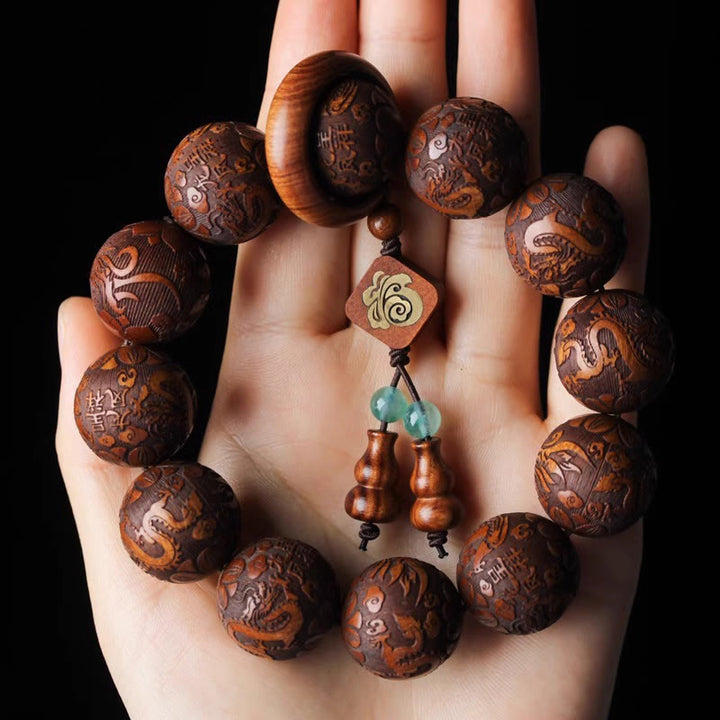 Bracelet de chaleur en perles de bois de rose avec Buddha Stones sculptées naturelles, dragon et phénix Fu