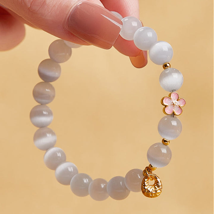 Bracelet œil de chat blanc en argent sterling 925 avec Buddha Stones et fleur de pêcher naturelle
