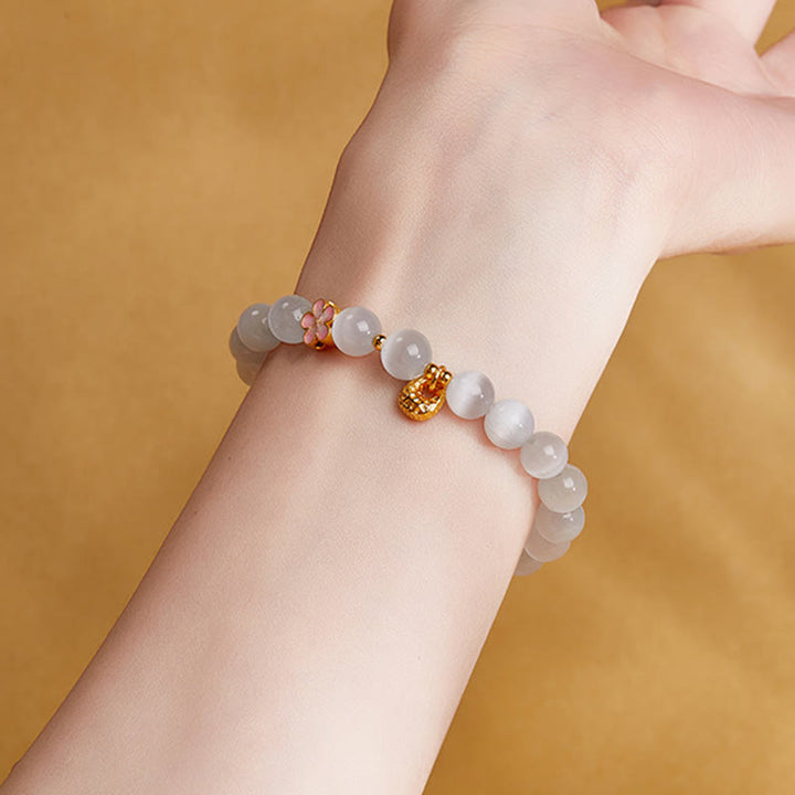 Bracelet œil de chat blanc en argent sterling 925 avec Buddha Stones et fleur de pêcher naturelle