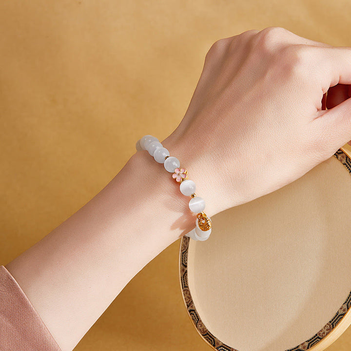 Bracelet œil de chat blanc en argent sterling 925 avec Buddha Stones et fleur de pêcher naturelle
