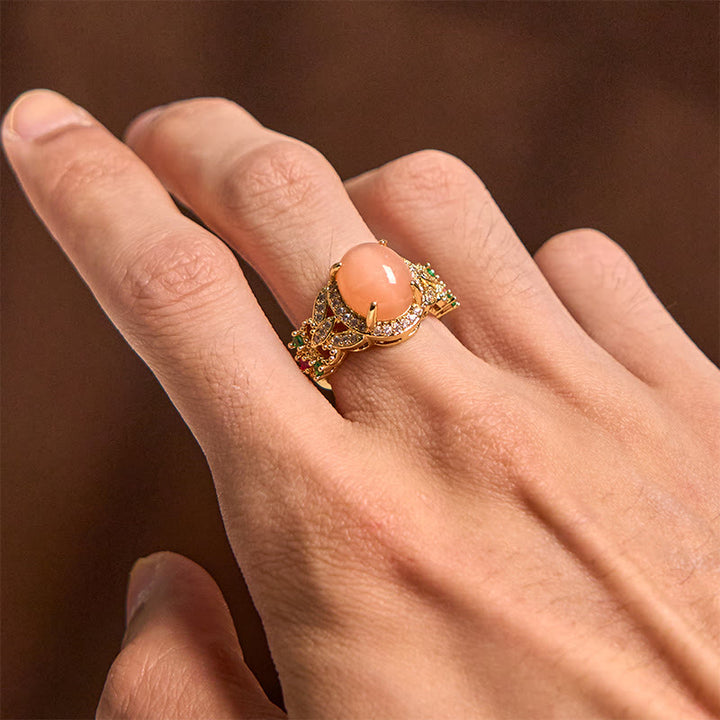 Bague ajustable en pierre de lune pêche, sertie de Buddha Stones