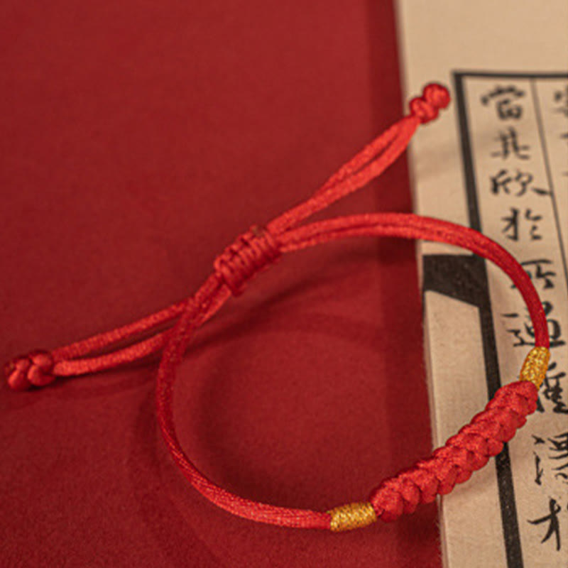 Bracelet en corde rouge tressée à la main avec nœud plat et Buddha Stones