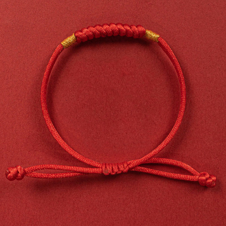 Bracelet en corde rouge tressée à la main avec nœud plat et Buddha Stones