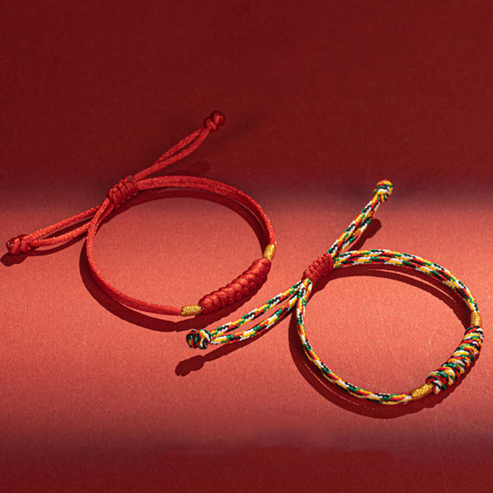 Bracelet en corde rouge tressée à la main avec nœud plat et Buddha Stones