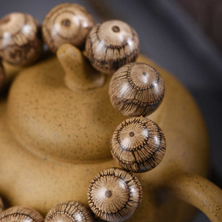 Bracelet de protection en perles de bois de Gnetum et pierres de Buddha Stones - image 3