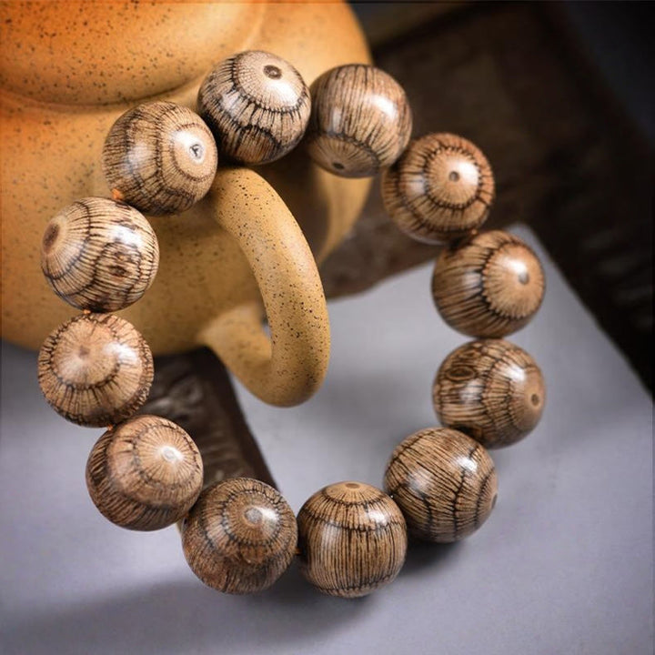 Bracelet de protection en perles de bois de Gnetum et pierres de Buddha Stones - image 9