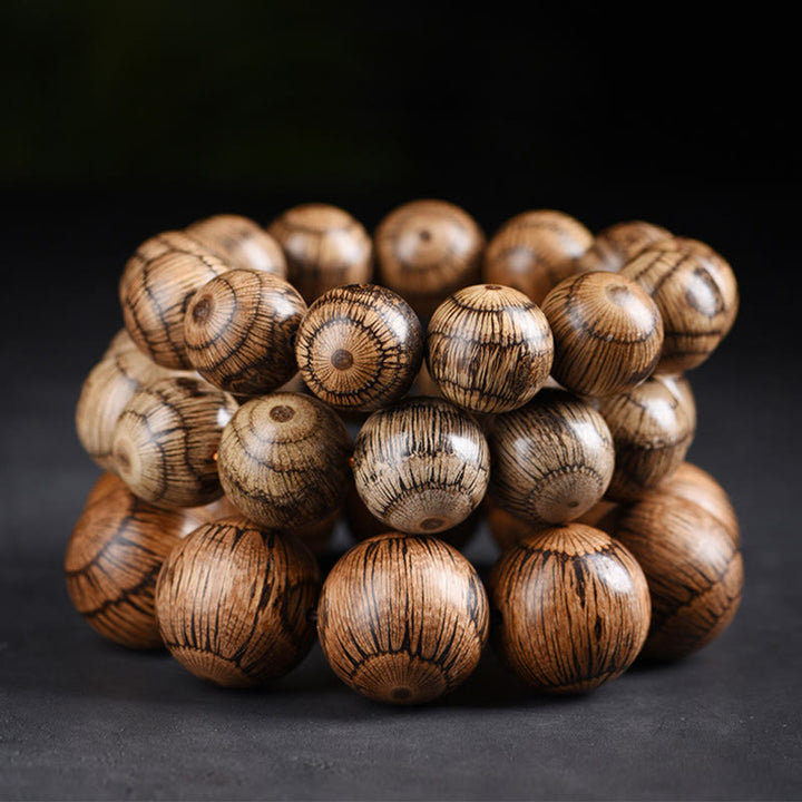 Bracelet de protection en perles de bois de Gnetum et pierres de Buddha Stones - image 12